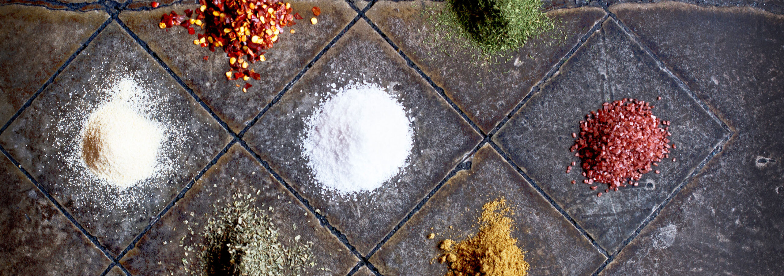 Duke's Seafood Spices Colorful Spices On Tile Floor